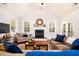 Inviting living room with a vaulted ceiling, fireplace, and comfortable seating, perfect for relaxation and entertaining at 2107 Nicholas David Path, Johns Island, SC 29455
