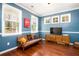 Comfortable living room with natural light, wooden floors, and stylish furniture at 2107 Nicholas David Path, Johns Island, SC 29455