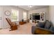 Relaxing living room with a rocking chair and entertainment center at 2107 Nicholas David Path, Johns Island, SC 29455