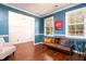 Bright living room with blue walls and a cozy couch by the window at 2107 Nicholas David Path, Johns Island, SC 29455