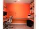 Vibrant home office featuring a custom wrap-around desk and ample shelving at 2107 Nicholas David Path, Johns Island, SC 29455