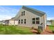 Landscaped backyard featuring a well-maintained lawn at 2179 Macallan Blvd, Ravenel, SC 29470