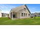 Backyard featuring a covered patio and well-maintained lawn at 2179 Macallan Blvd, Ravenel, SC 29470