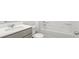 Pristine bathroom featuring a white vanity with a modern faucet and a bathtub with shower at 2179 Macallan Blvd, Ravenel, SC 29470