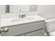 This bathroom features a sink with gray cabinets and a toilet at 2179 Macallan Blvd, Ravenel, SC 29470