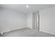 Minimalist bedroom with carpet, three doors, and neutral paint at 2179 Macallan Blvd, Ravenel, SC 29470