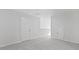 Neutral-toned bedroom featuring carpet, two doors, and overhead lighting at 2179 Macallan Blvd, Ravenel, SC 29470