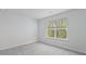 Cozy bedroom with a window offering a lush view of greenery at 2179 Macallan Blvd, Ravenel, SC 29470
