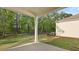 A covered patio that backs up to a wooded area that is perfect for entertaining guests and Gathering in the backyard at 2179 Macallan Blvd, Ravenel, SC 29470