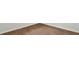 View of the beautiful light brown wood-look flooring with white walls and baseboards at 2179 Macallan Blvd, Ravenel, SC 29470