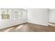 Bright living room featuring hardwood floors and large windows with views of the outdoors at 2179 Macallan Blvd, Ravenel, SC 29470