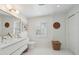 Bright bathroom with dual sinks, stylish mirrors, and tiled floors at 223 Grove St, Charleston, SC 29403