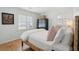 Bright bedroom featuring hardwood floors, white walls, and natural light at 223 Grove St, Charleston, SC 29403