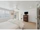 Bright bedroom with beamed ceilings and french doors, with a bathroom on-suite at 223 Grove St, Charleston, SC 29403