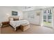 Bright bedroom with french doors and classic beach house decor at 223 Grove St, Charleston, SC 29403