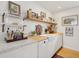 Modern kitchen featuring white cabinets, butcher block countertops, and open shelving at 223 Grove St, Charleston, SC 29403