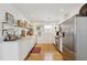 Sleek kitchen featuring white cabinets, stainless steel appliances, and hardwood floors at 223 Grove St, Charleston, SC 29403