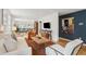 Expansive living area featuring modern decor, hardwood floors, and access to additional rooms at 223 Grove St, Charleston, SC 29403