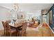 Combined dining and living area with hardwood floors, natural light, and stylish furniture at 223 Grove St, Charleston, SC 29403