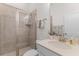 Modern bathroom with a tiled shower, quartz countertop, and stylish fixtures at 233 Ashmont Dr, Wando, SC 29492