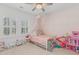 Adorable bedroom with decorative wallpaper, canopy bed and large windows at 233 Ashmont Dr, Wando, SC 29492