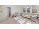 Spacious bonus room with three windows, ideal for playroom or relaxing at 233 Ashmont Dr, Wando, SC 29492