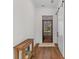 Welcoming entryway with hardwood floors, a wooden bench, and a stylish barn door at 233 Ashmont Dr, Wando, SC 29492