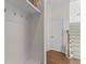 Hallway featuring built-in storage, coat hooks, and a staircase leading to upper floors at 233 Ashmont Dr, Wando, SC 29492