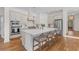Bright, modern kitchen features a large island, stainless steel appliances, and hardwood floors at 233 Ashmont Dr, Wando, SC 29492