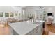 Open-concept living space with a large kitchen island, dining area, and living room at 233 Ashmont Dr, Wando, SC 29492
