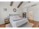 Light-filled main bedroom with hardwood floors, vaulted ceilings with beams, and neutral decor at 233 Ashmont Dr, Wando, SC 29492