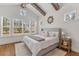 Serene main bedroom with vaulted ceilings, exposed beams, and ample natural light at 233 Ashmont Dr, Wando, SC 29492