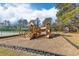 Wooden playground with slide features steps and covered area at 233 Ashmont Dr, Wando, SC 29492
