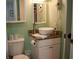 Compact bathroom featuring a modern vanity with a vessel sink and a toilet at 259 Sea Cloud Cir, Edisto Island, SC 29438