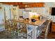 Bright kitchen with granite countertop bar, white cabinets, and modern appliances at 259 Sea Cloud Cir, Edisto Island, SC 29438
