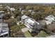 Picturesque aerial shot of a luxurious home with metal roof, well-manicured lawn, and beautiful landscaping in a tree-filled area at 2607 Cameron Blvd, Isle of Palms, SC 29451