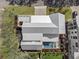 Overhead view of the modern home with a metal roof, pool, mature landscaping, and proximity to nearby parks at 2607 Cameron Blvd, Isle of Palms, SC 29451
