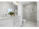 Elegant bathroom with marble tile, double vanity, and glass-enclosed shower with modern fixtures at 2607 Cameron Blvd, Isle of Palms, SC 29451