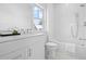 Bright bathroom with white subway tile shower and white marble floor at 2607 Cameron Blvd, Isle of Palms, SC 29451