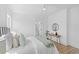 Cozy bedroom with light hardwood floors, white walls, and a bathroom walkthrough at 2607 Cameron Blvd, Isle of Palms, SC 29451