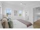 Bright bedroom featuring three windows, with an open door to the bathroom at 2607 Cameron Blvd, Isle of Palms, SC 29451