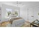 Well-lit bedroom boasting natural light, stylish décor, and hardwood floors at 2607 Cameron Blvd, Isle of Palms, SC 29451
