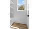 White closet features built-in shelves and wood floor with natural light at 2607 Cameron Blvd, Isle of Palms, SC 29451