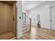 Bright hallway featuring an elevator, hardwood floors, natural light, and elegant design elements at 2607 Cameron Blvd, Isle of Palms, SC 29451