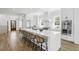 Spacious white kitchen with stainless steel appliances, large island, and barstool seating at 2607 Cameron Blvd, Isle of Palms, SC 29451