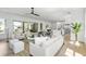 Bright and airy living room with lots of windows and natural light, and a neutral color palette at 2607 Cameron Blvd, Isle of Palms, SC 29451