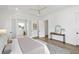 Bright main bedroom with hardwood floors, an ensuite bathroom, and calming natural light at 2607 Cameron Blvd, Isle of Palms, SC 29451