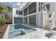 Backyard oasis featuring a sparkling pool and spa, perfect for relaxation and entertainment under the covered patio at 2607 Cameron Blvd, Isle of Palms, SC 29451