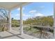 Covered porch with a view of a tree-lined neighborhood street at 2607 Cameron Blvd, Isle of Palms, SC 29451