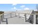 Spacious rooftop deck boasts modern railing and stunning architectural roofline at 2607 Cameron Blvd, Isle of Palms, SC 29451